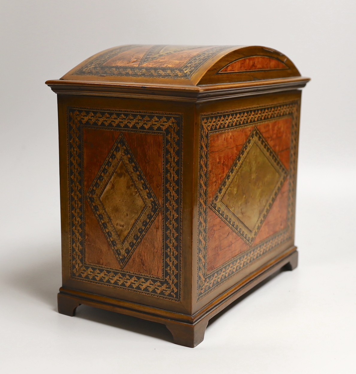 A Sorrento inlaid bird’s eye maple ten drawer miniature chest, 27cms x wide 26.5 cms high